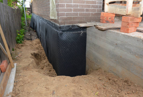 SJ Waterproofing Pros technician performing targeted Exterior Waterproofing assessment in Riverside, MI